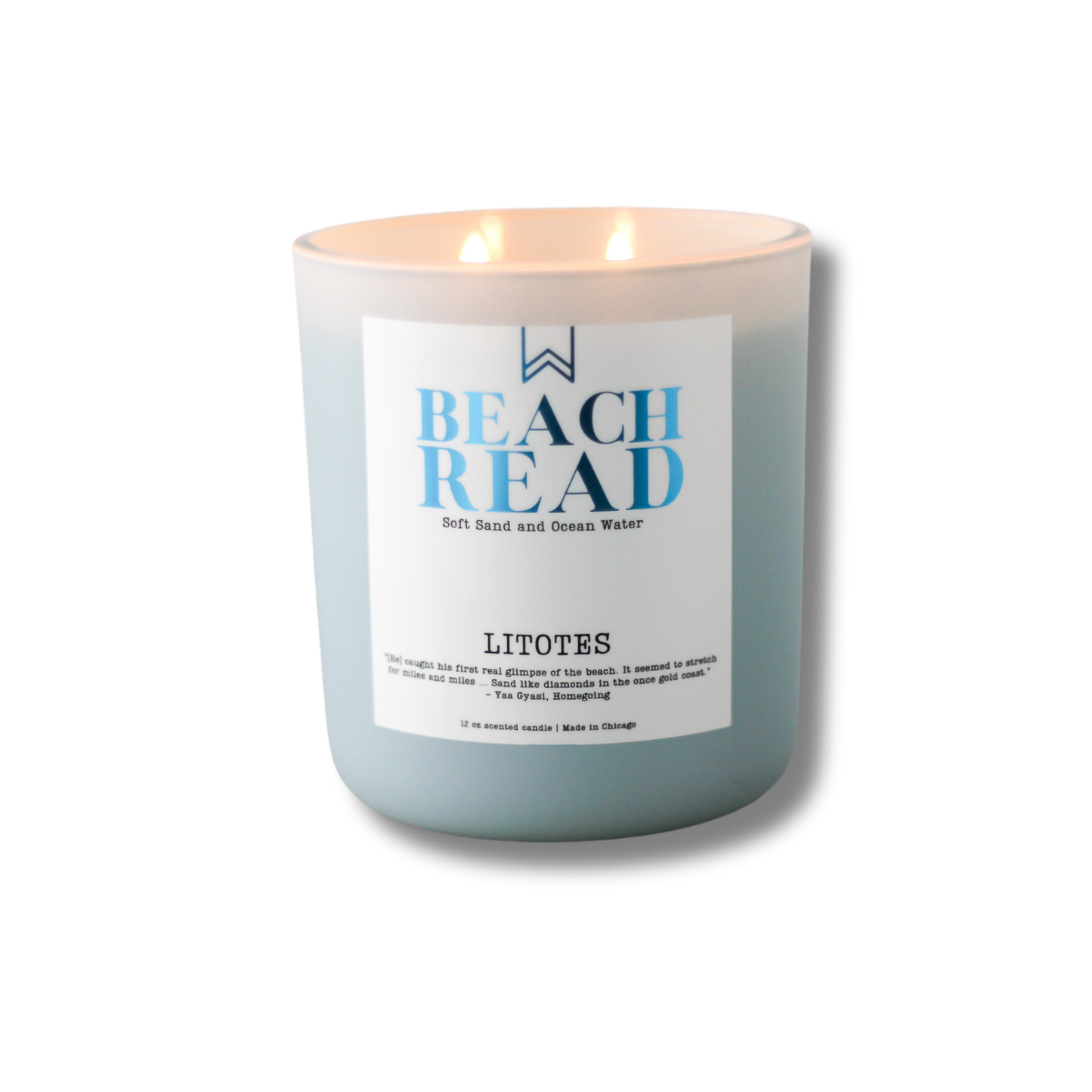 A white candle with blue label reading 'BEACH READ' from LITOTES, describing the fragrance as 'Soft Sand and Ocean Water'.