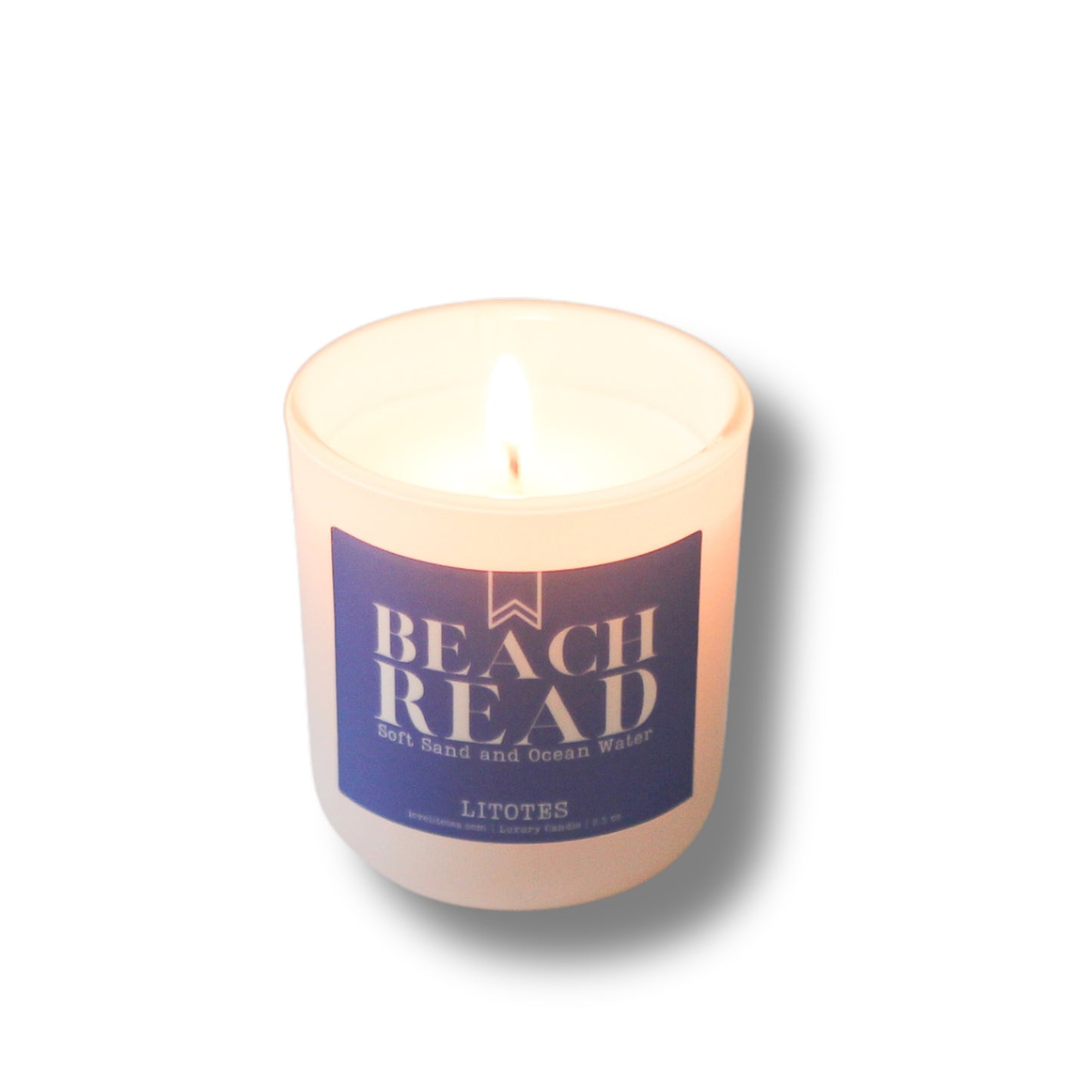 Candle with a 'Beach Read' label on a white background