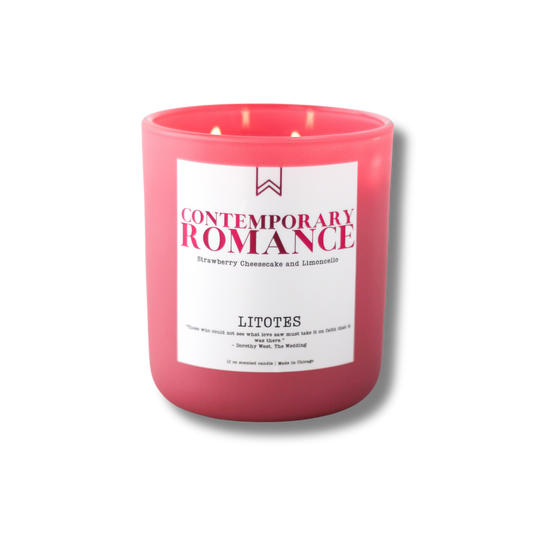 A blush pink candle with a label that reads 'Contemporary Romance', with the brand name 'LITOTES' and the scent name 'Limoncello and Strawberry Cheesecake'. The candle has two wicks.