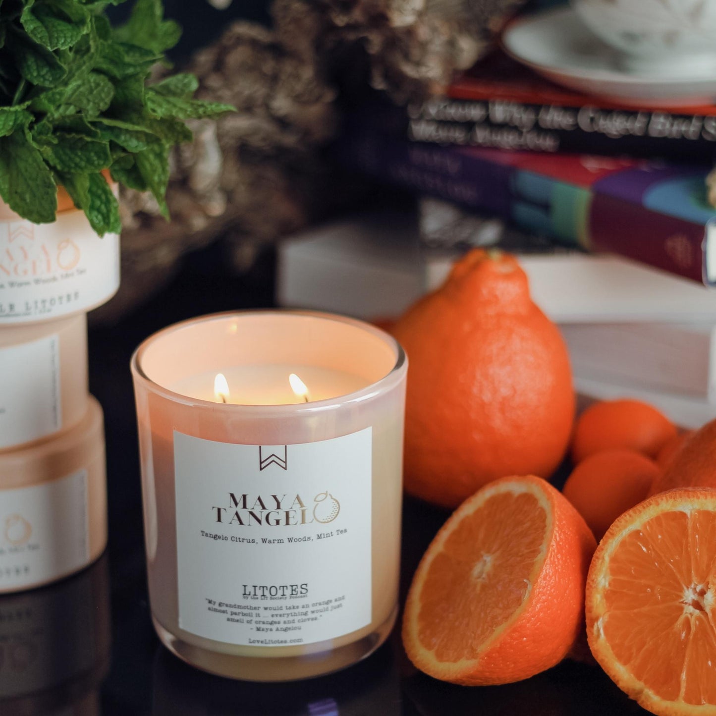 Black-owned, woman-owned, Chicago-made luxury soy candle with tangelo citrus, woods, and mint tea aroma. Celebrating the work and life of Maya Angelou, candles handcrafted in small batches.