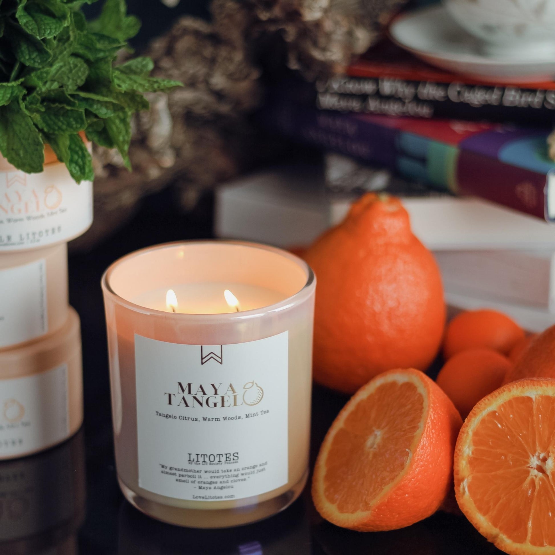 Black-owned, woman-owned, Chicago-made luxury soy candle with tangelo citrus, woods, and mint tea aroma. Celebrating the work and life of Maya Angelou, candles handcrafted in small batches.